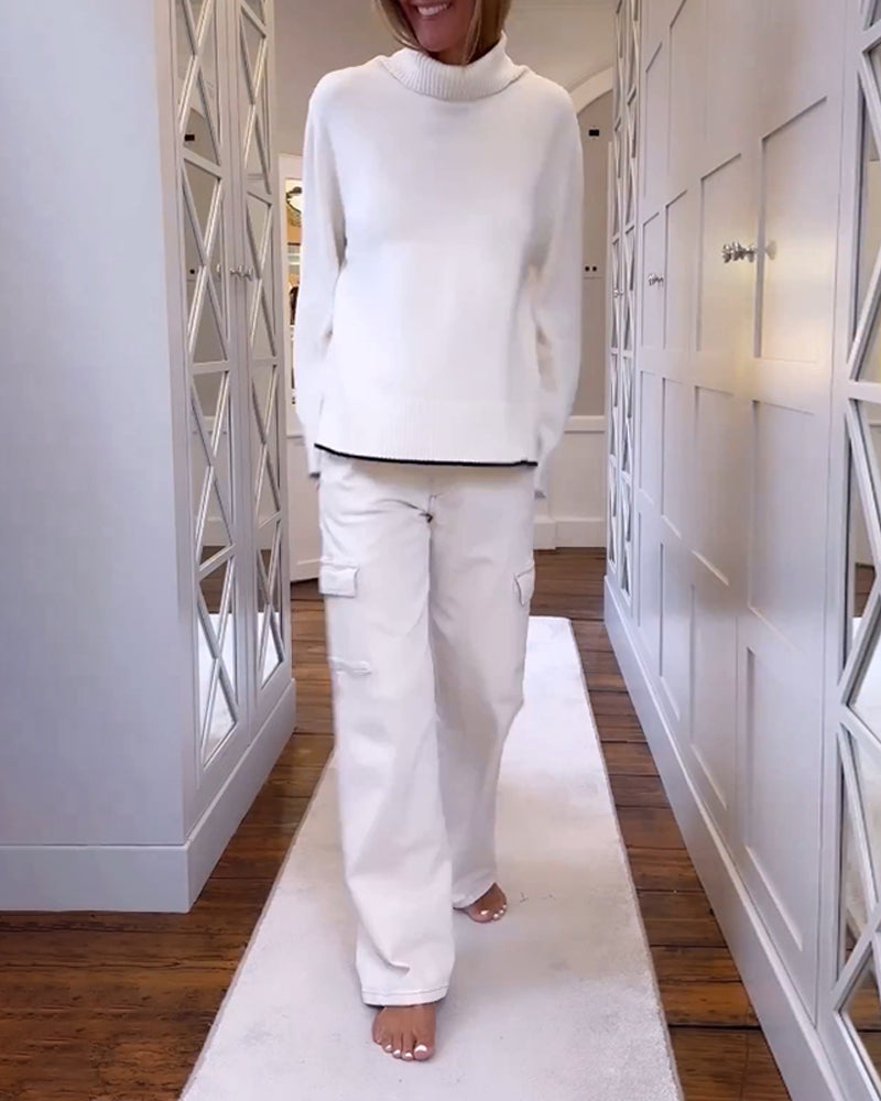 Pull avec le cou haut et les manches longues